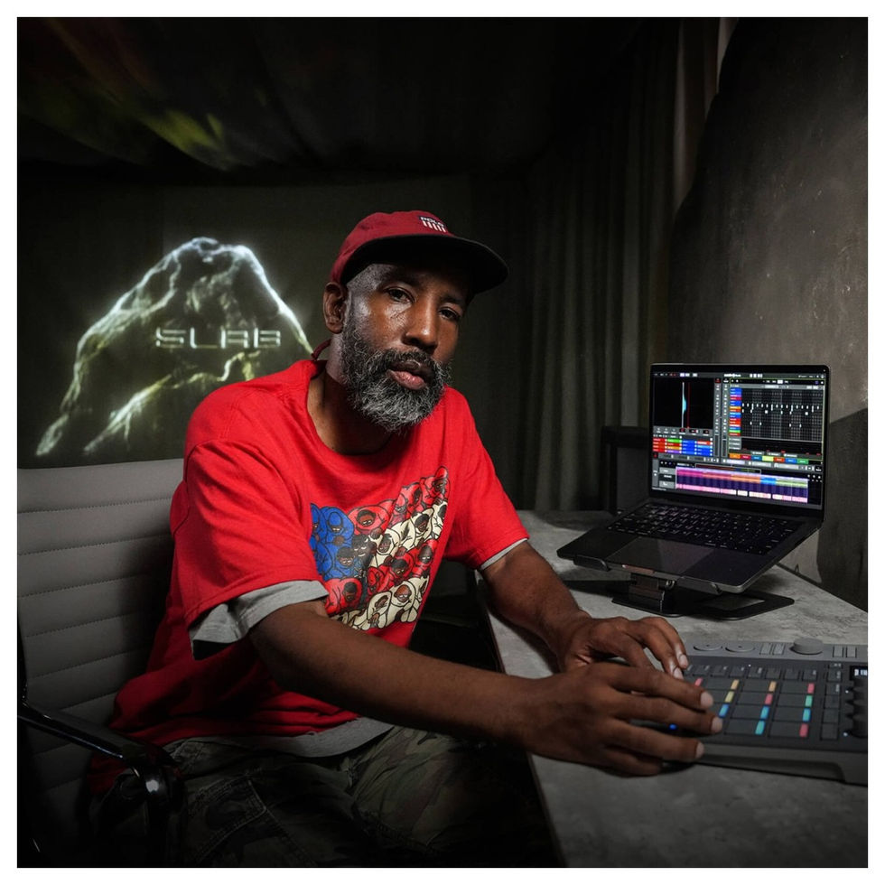 Image of AlphaTheta Slab MIDI Controller being used by a male model with beard