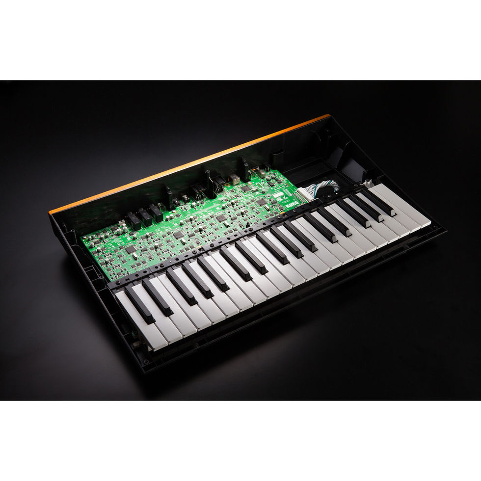Image of Korg Minilogue Polyphonic Analogue Synthesiser top view without lid on showing internal circuit board