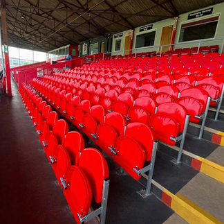 Angled view of Link Mirage tip-up stadium seats installed in the Main Stand at Cheltenham Town FC