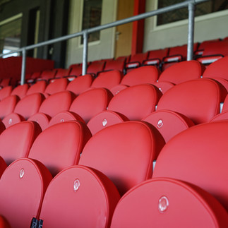 Luxury padded VIP stadium seats featuring bespoke upholstery at Cheltenham Town FC