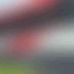 Wide angled image of completed red and white seating banks in the upgraded Trillick GFC stand.