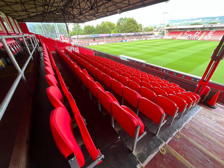 view of the completed stand showing the new seats overlooking the pitch.
