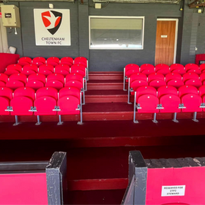 View of newly installed seating in the directors and hospitality section, featuring club branding and a fully refurbished viewing area.