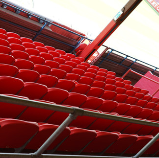Modern spectator seating layout featuring Link Mirage seats at Cheltenham Town FC stadium