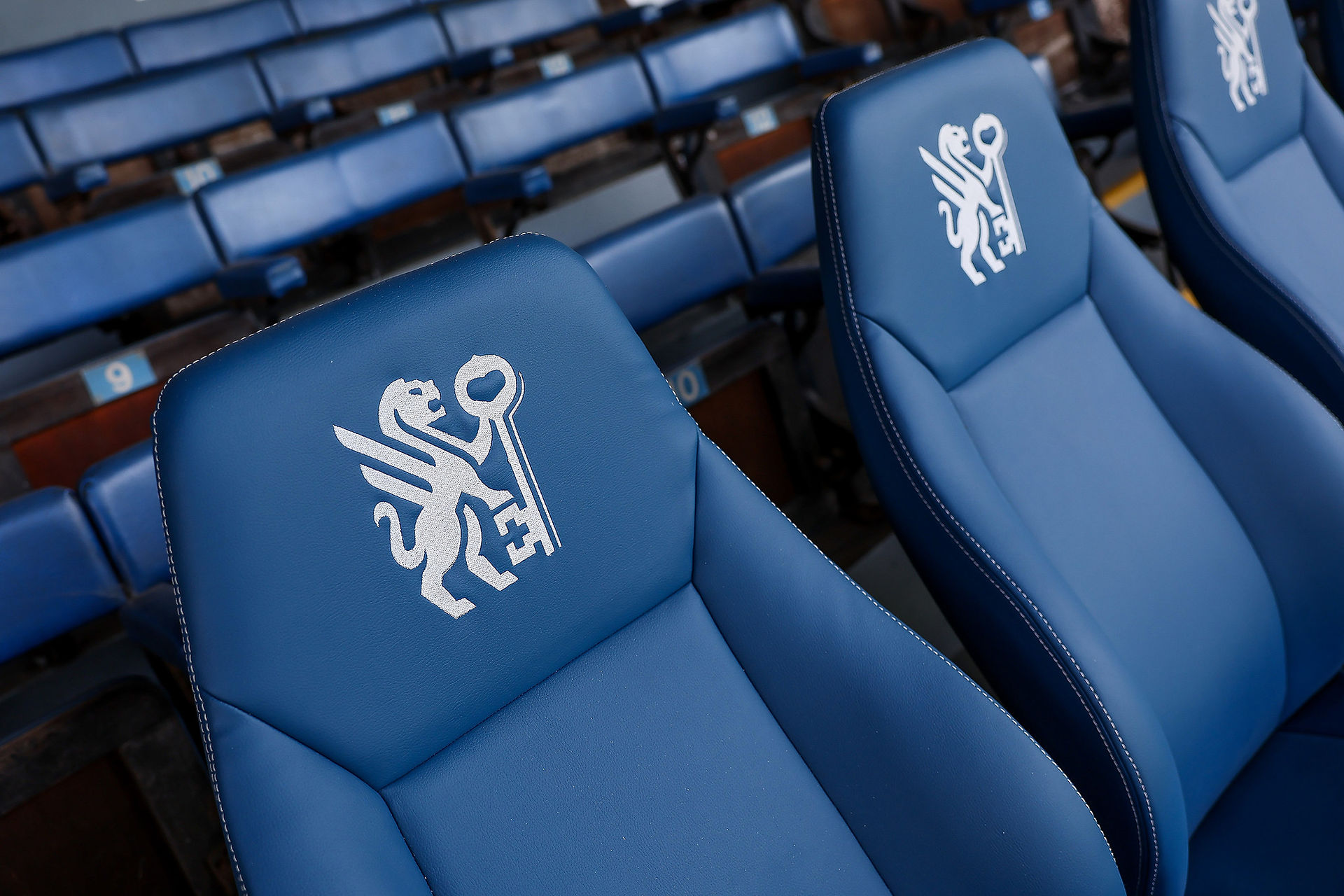 Close-up of embroidered Peterborough FC crest on bespoke players' seating