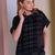 Thumbnail: Model wearing NAYA NAW26230 Black and Grey check knit top with leatherette trousers