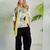 Back view of the NAYA blurred spot print tunic top in black and white with short sleeves.