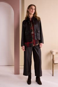 Thumbnail: Model wearing NAYA NAW26289 Clove check organza button-through shirt with Choko trousers