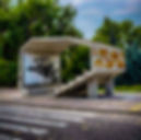 brutalist architecture featuring bold graffiti art, blending urban design with street culture
