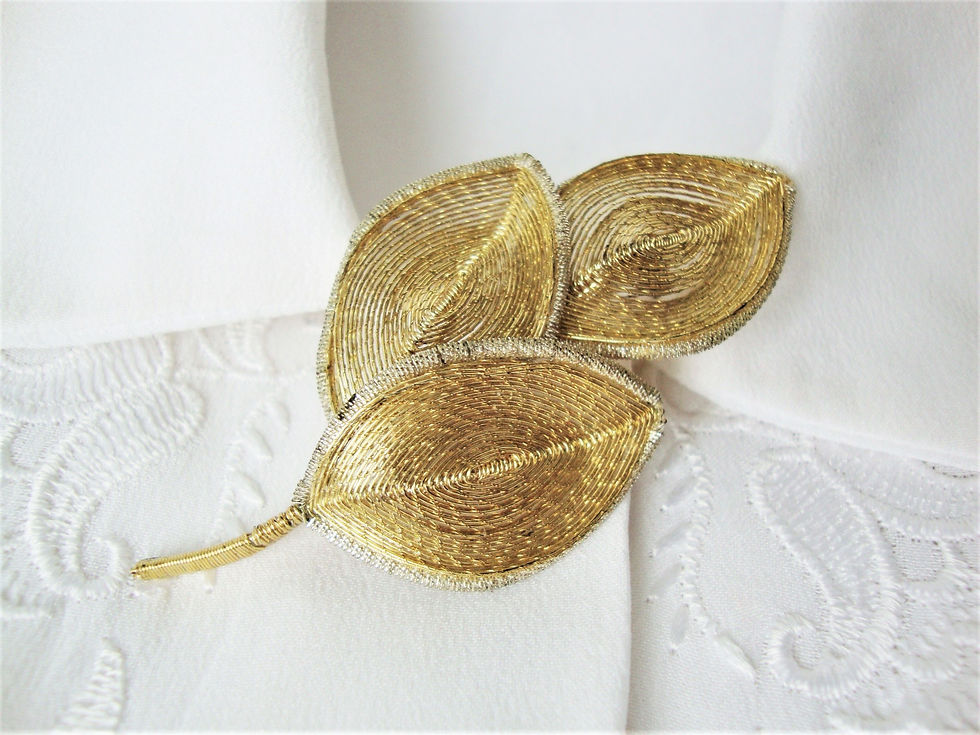 Wire leaf sprig brooch on blouse G&BA