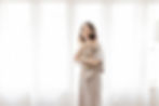 by the window mom and baby. Newborn photography by Meliza Orellana Photography