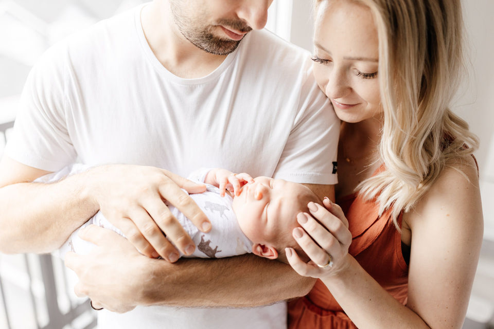 Meliza Orellana Photography_Home Page Gallery_Vancouver Maternity Photographer_Couple looking at the newborn baby in their arms