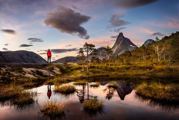 Capture the beauty of twilight on an evening hike with dinner, featuring stunning mountain scenery