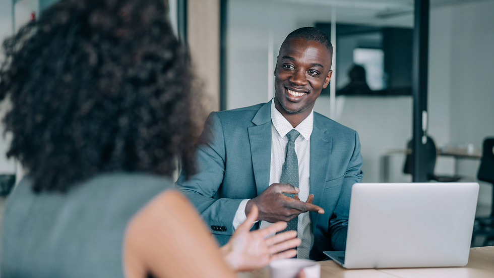 Colleagues discussing sales data and performance strategy during a meeting. 