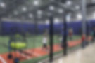 image of the Bassball Cages with individuals batting.