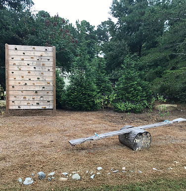 Natural rock climbing wall and see-saw
