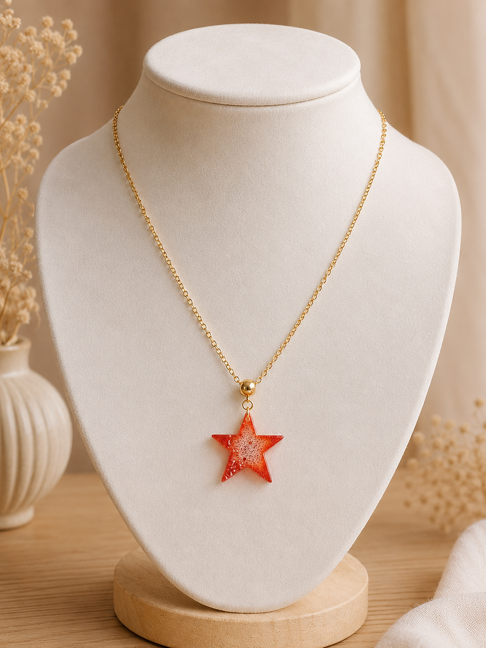 Miniature : Boucles d’oreilles étoile en résine orange pailletée