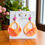 Miniature : Boucles d'oreilles artisanales orange nacré et papillon rose