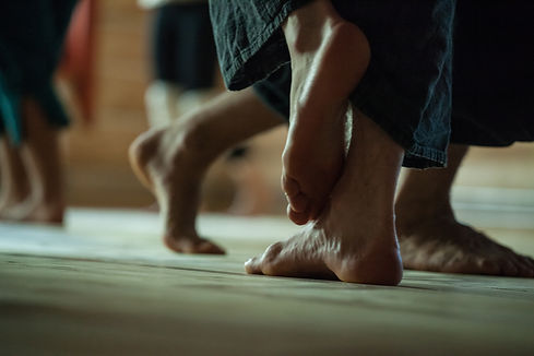 many dancers foots on floor, on blurred background_.jpg