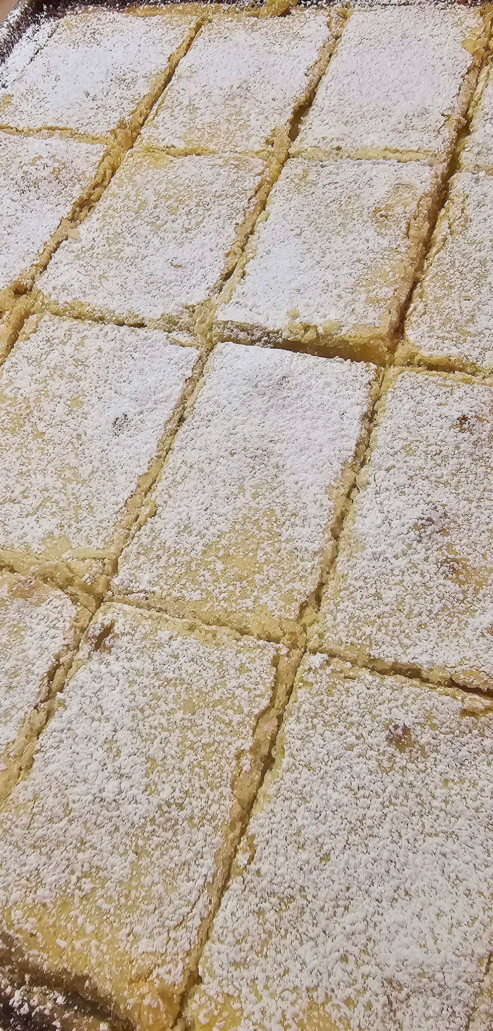 Thumbnail: lemon bar tray sprinkled with powdered sugar
