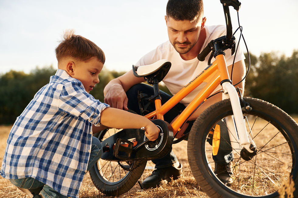 vecteezy_sitting-and-repairing-the-bike-dad-with-son-are-with_66827197.JPG