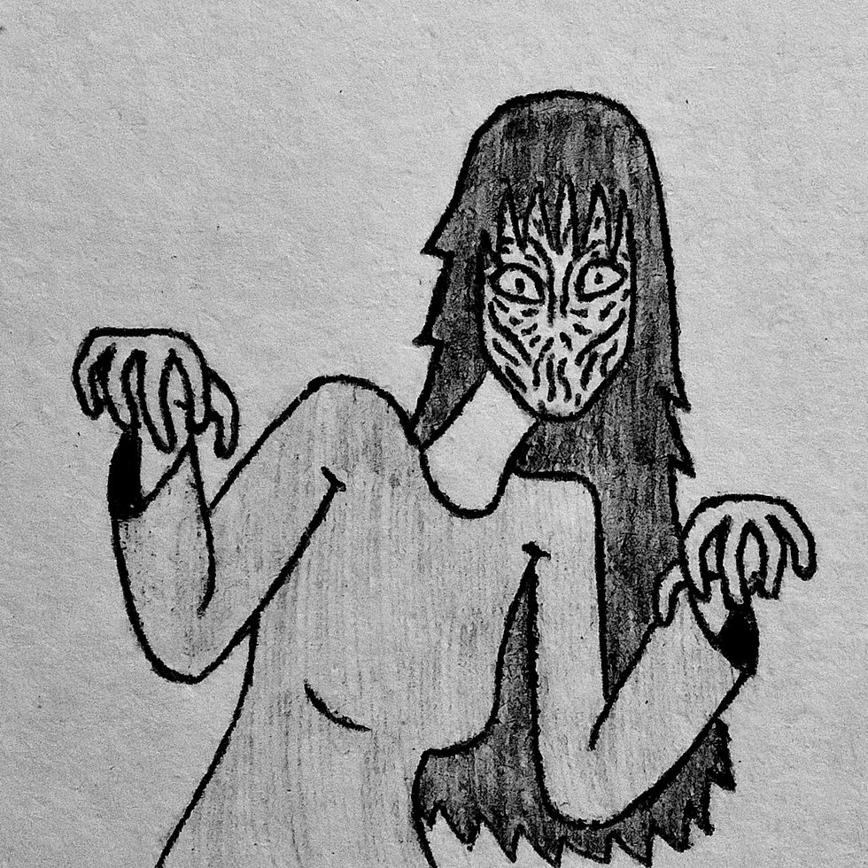 A woman without a mouth staring and holding her hands up and having finger hang down to look ghoulish.