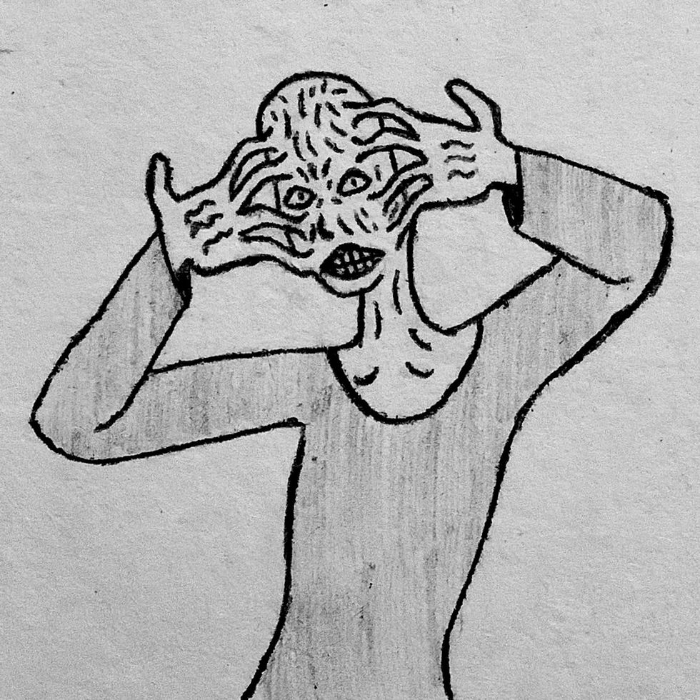 A bald wrinkly man with the skin of his fingers stuck on head.