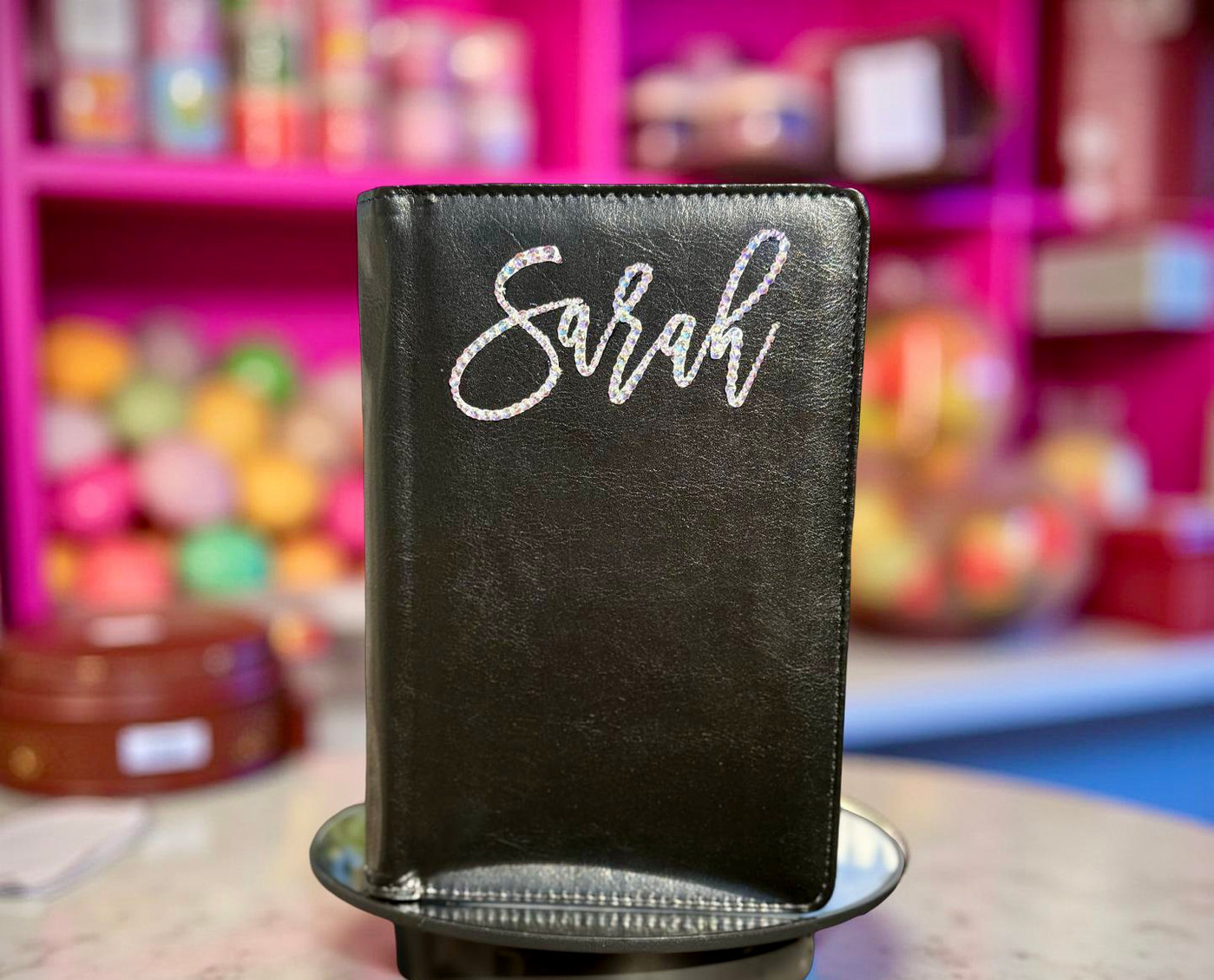 A luxury custom bedazzled server book with personalized text and rhinestone accents.