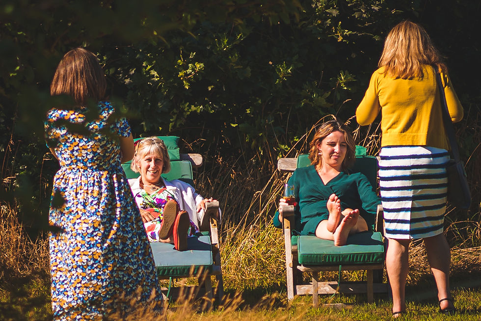 Wedding guests sat on deck chairs