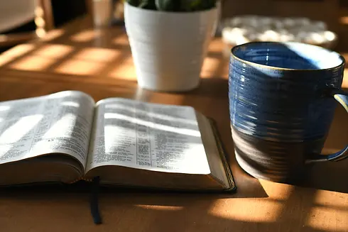 open-bible-in-early-morning-light-with-coffee-mug-2025-03-11-18-35-38-utc.webp