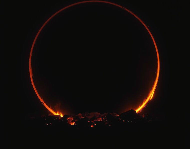 Ember Circle__A dark background with a glowing circle of embers or firelight on the ground
