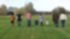 Group of adults and children walking