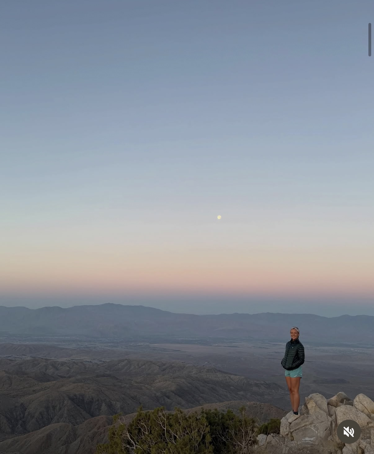Erin on a mountain overlook at twilight