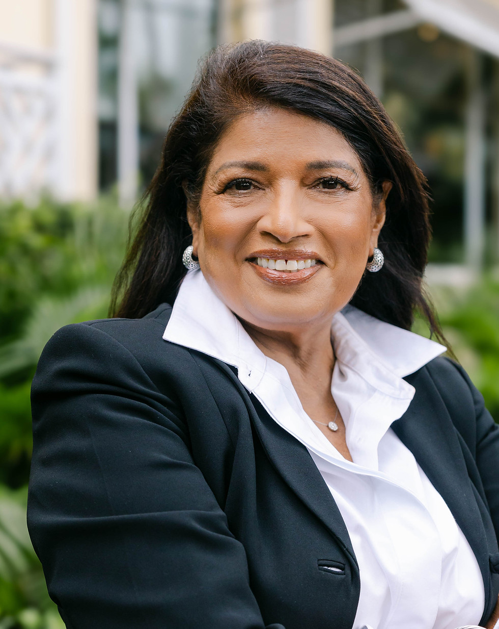 Outdoor with arms crossed in jacket.jpg