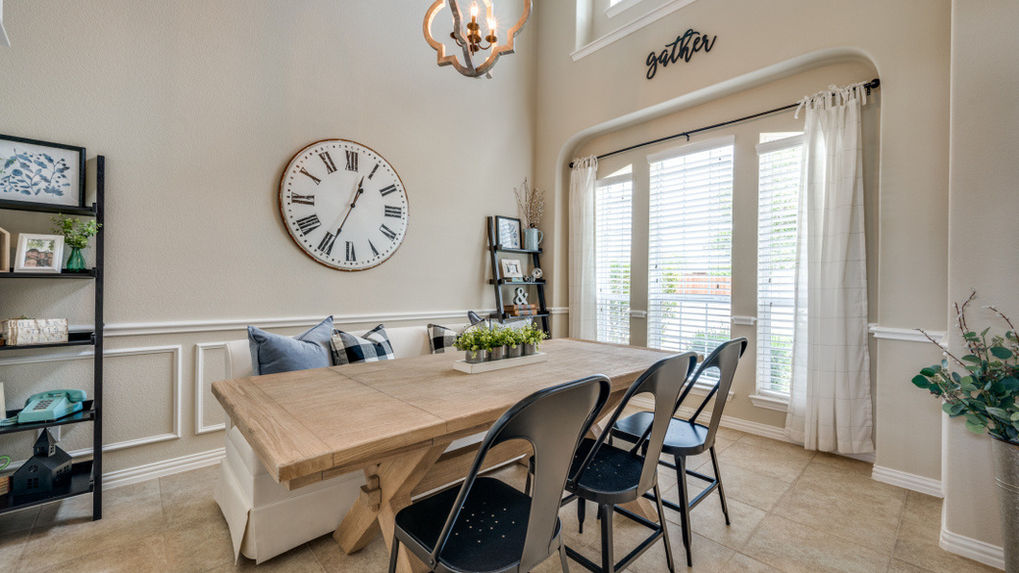 Experience the charm of Chic Designs' farmhouse dining, featuring a stylish upholstered bench. Immerse yourself in the rustic elegance, curated details, and inviting atmosphere, creating a perfect blend of comfort and sophistication