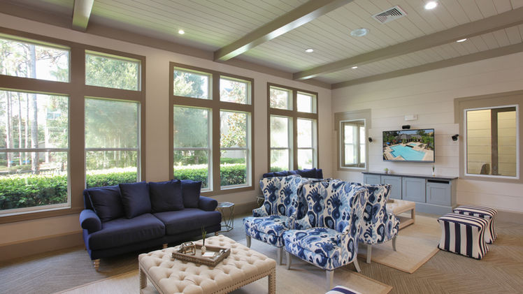 Explore the captivating interior of the clubhouse at Lantower Cypress Creek, showcasing a different angle of the chic design by Chic Designs. Immerse yourself in modern aesthetics, inviting furnishings, and a lively ambiance for residents to enjoy community gatherings and leisure