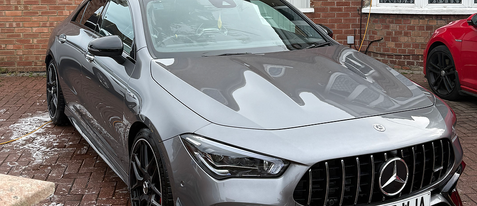 Safe exterior car wash removing dirt and contaminants during detailing process.