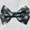 Thumbnail: A black pet bow tie with a white paw print pattern.