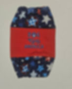 Dog snood made with patriotic red white and blue stars on solid blue that says Dog Bless American in the center on sold red f