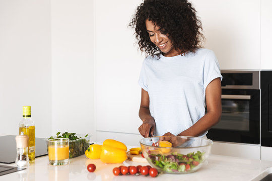 Woman Cutting Vegetables with Knife
