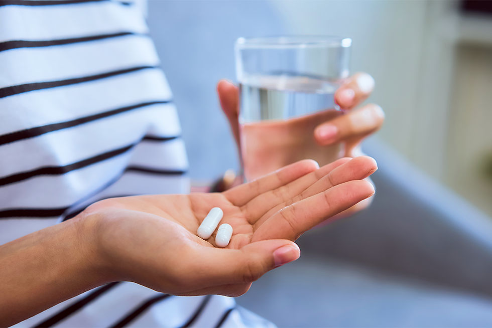 Person With Medication Pills in Hand