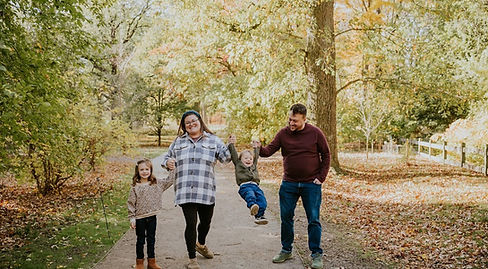 AJ and his family in the arboretum