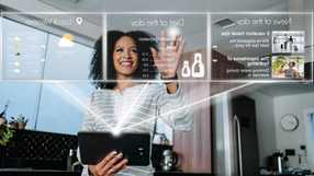 A woman interacts with a digital interface displaying weather, diet, and news information in a kitchen