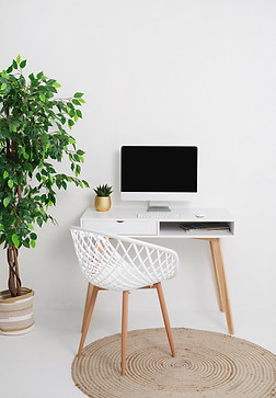 Minimal home office setup with desk and computer representing bespoke website design