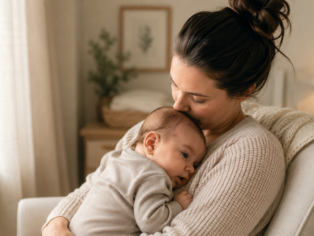 Mother holding her sleeping baby in a calm home environment
