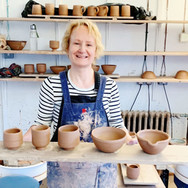 Deborah holding her first pots