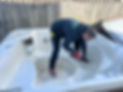 One of our Rapid Junk Removal crew dismantling a hot tub for removal and disposal.