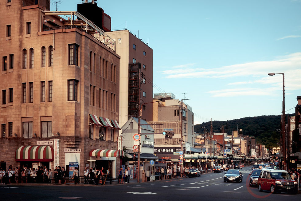Bustling Gion shopping streets in Kyoto, lined with traditional buildings and vibrant storefronts, as local residents and tourists like to explore.