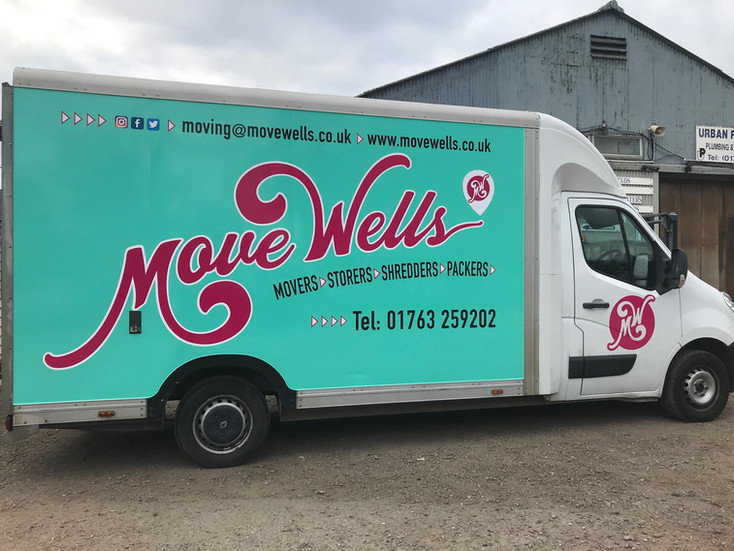 Luton van with large Move Wells vehicle graphics and branding, highlighting professional van wrap design for advertising