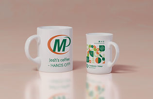 Custom printed mugs shown on 2 different styles of white ceramic cup. White builder's mug printed with Minuteman Press Cambridge logo and 'Josh's coffee - hands off' text, white latte cup with generic brand design. Light orange coloured background and cup surface reflections.